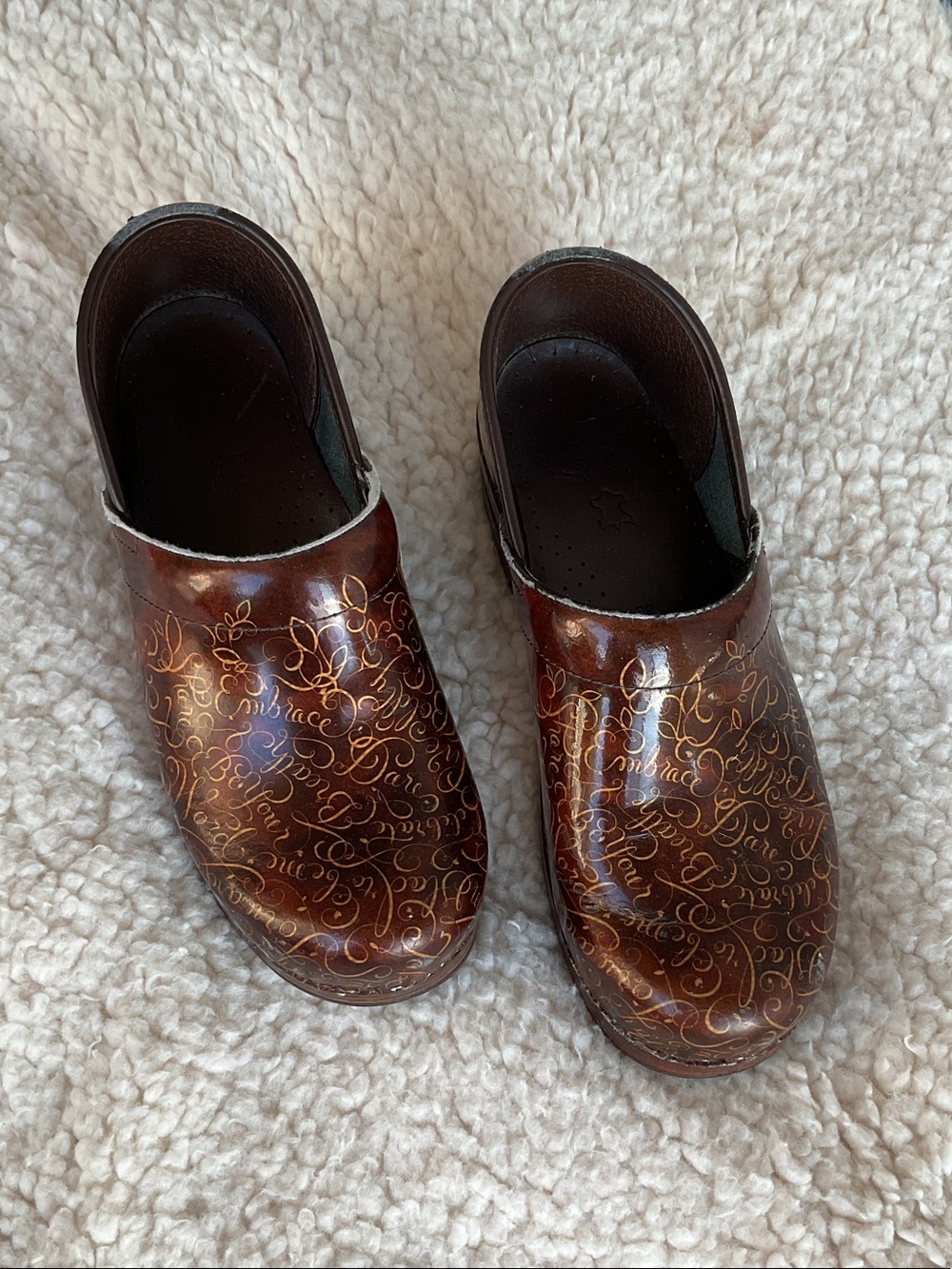 Dansko Brown Leather Clogs with Gold Script Accents